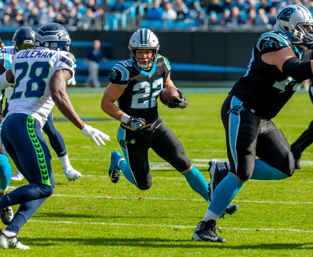 # 22 of the Carolina Panthers - Christian McCaffrey rushing in an NFL game