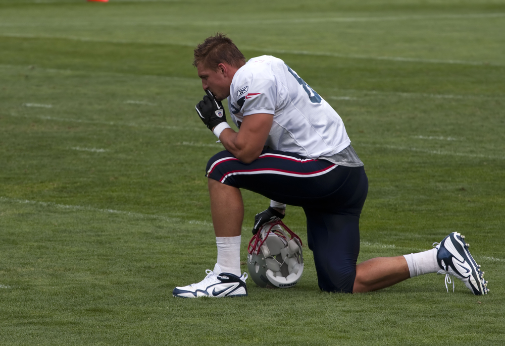 Rob Gronkowski taking a breather on one knee